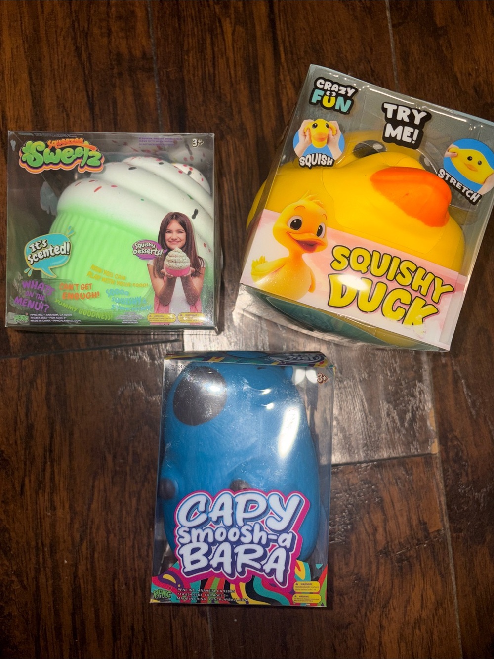 THREE different Squishys, Yellow Duck, Cupcake and Blue Capy Bear (all 3 )